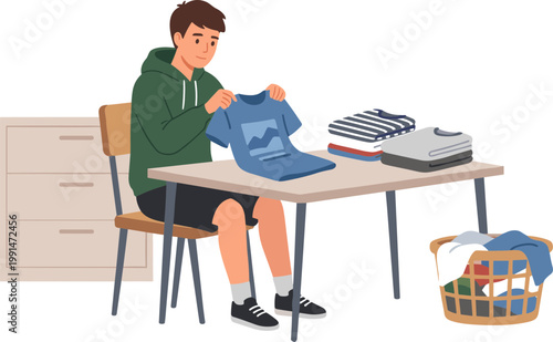 A man folds clothes on a table in a room with a basket nearby.