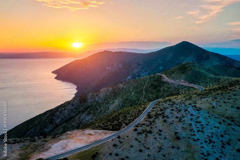 Naklejka premium Sunset over tranquil waters, painting the sky in vibrant hues. Location place Kvarner Gulf, Cres island, Croatia, Europe.