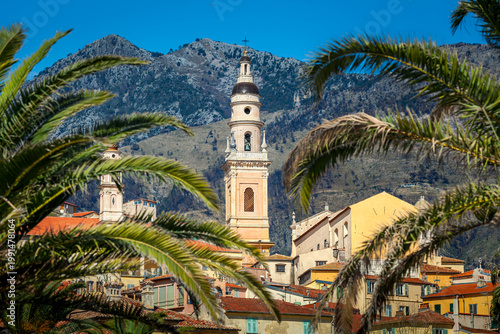 View of the Basilica of Saint Michael Archangel bell tower rising above the old town of Menton, France.