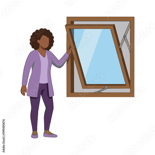 A woman holds and examines a broken glass window pane closely indoors.