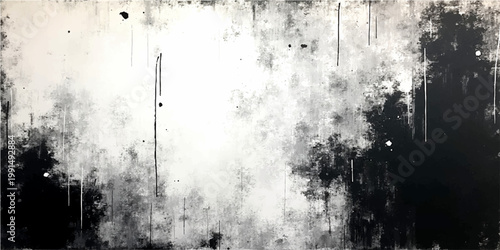Abstract black and white textured grunge background with ink blotches, drips and paint splashes evoking artistic impression.