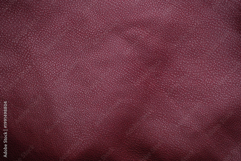 Fototapeta premium Close up of textured deep red leather material
