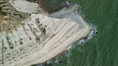 stair of the turks. Aerial view of coastal cliffs with layered white rock formations and turquoise waters, showcasing the natural beauty of the shoreline and surrounding landscape