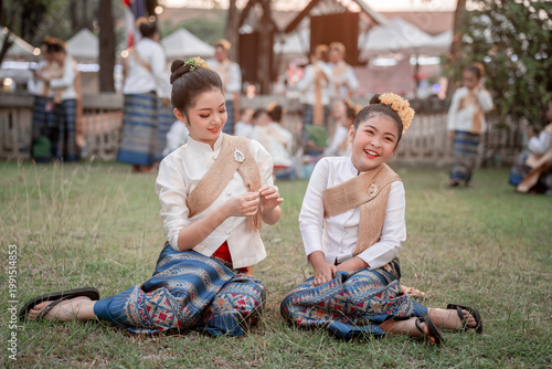 Traditional Thai Children in Cultural Attire Smiling in Nature