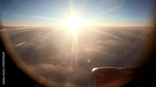 Sunset Clouds Glow. Cinematic Evening Shot With Silhouetted Engine Amidst Vibrant Sunset Clouds. Dramatic Sunset Highlighting Golden Light And Cloud Formation With Silhouetted Aircraft In Warm Tones