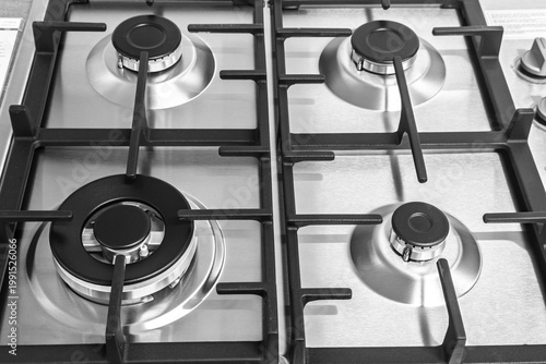 Φωτογραφία Close up of stainless steel gas cooktop with four burners