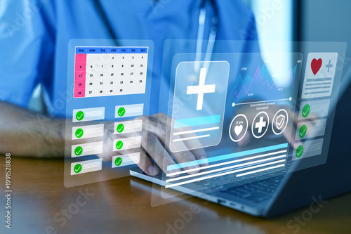 A healthcare professional interacts with advanced medical technology, showcasing digital interfaces and data management on a laptop for improved patient care.