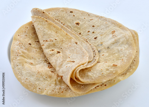 Photos Fresh folded chapatis stacked neatly on a serving plate