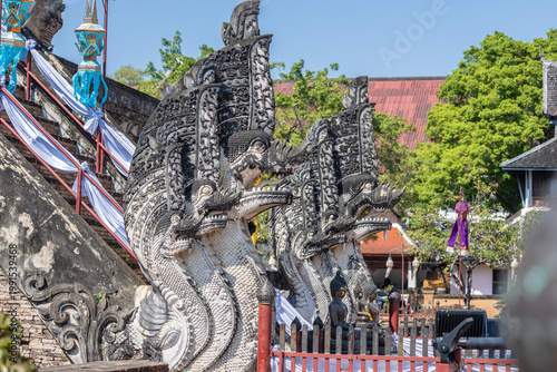 Принти на полотні Ornate Naga serpent statues, intricately carved, guard the entrance stairs of Wat Chedi Luang in Chiang Mai, Thailand