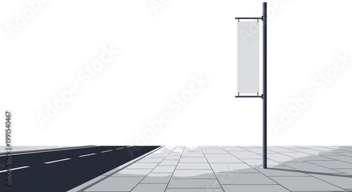 Modern Street Banner Displayed on a Pole Alongside a Paved Road in an Urban Setting