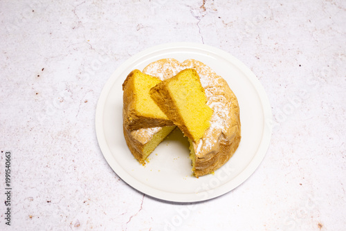 Slika na platnu Homemade Savoie cake on a pretty white porcelain dish