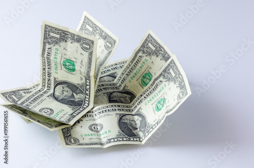 фотографія US dollar banknotes with a denomination of one dollar on a white background
