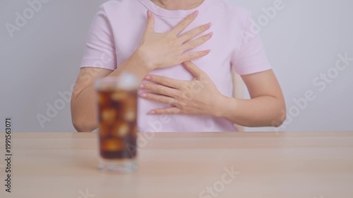 Woman hand stop and refuse gesture to carbonated soft drink, feeling Abdominal pain after drinking soda water, bloating and gas in digestive system, stomach ache, Acid reflux, Heartburn and Gastritis