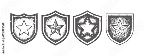 Four distressed shield emblems with stars in dark gray badge insignia