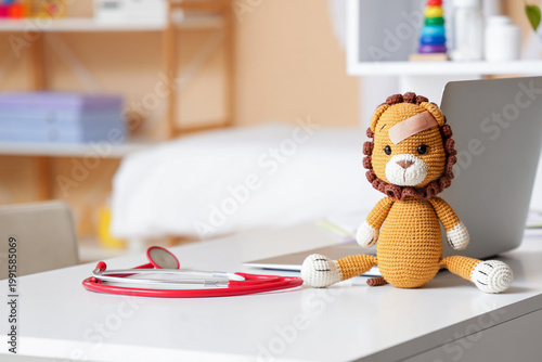 Toy lion with stethoscope a...