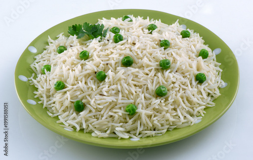 Quadro em tela Traditional white peas rice or Matar Pulao on a green plate with white backgroun