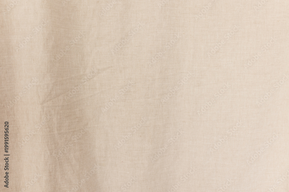 Fototapeta premium Detailed texture of natural beige linen fabric with soft wrinkles.