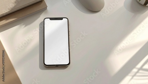 Smartphone on white table surface.