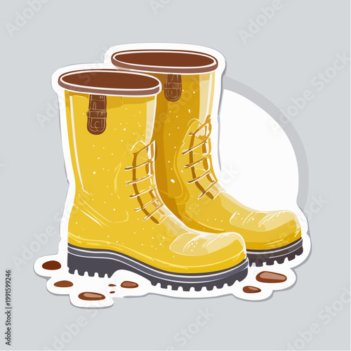 Pair of yellow rain boots with muddy accents