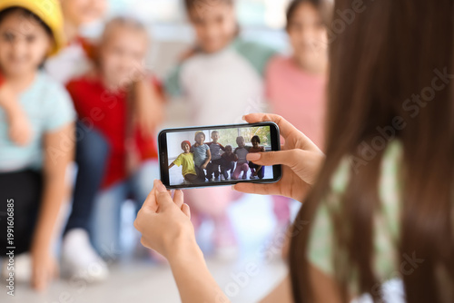 Female teacher taking pictu...