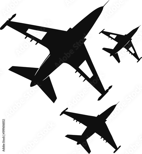 Silhouettes of three fighter jets flying in formation
