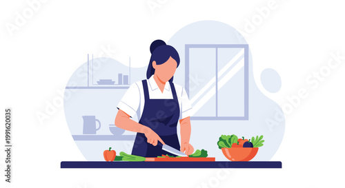 A focused chef wearing a dark apron stands in a modern kitchen while precisely chopping fresh green vegetables on a wooden cutting board at home.