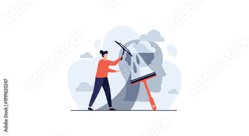 A person in an orange shirt uses a large squeegee to clean a giant silhouette of a human head against a soft cloudy blue background in a studio.