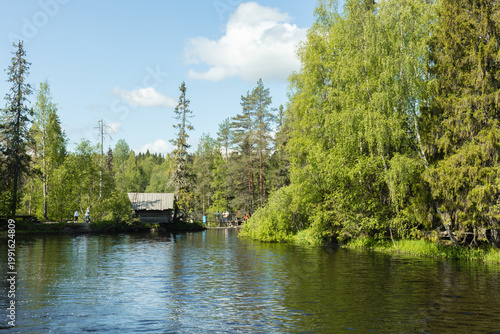 Принти на полотні Landscape with a wooden hut on the bank of a forest river in Karelia, eco-trail,