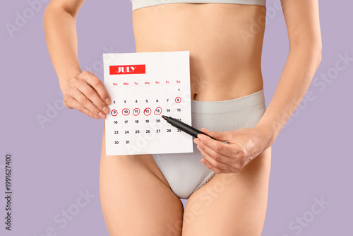 Young woman in panties with...