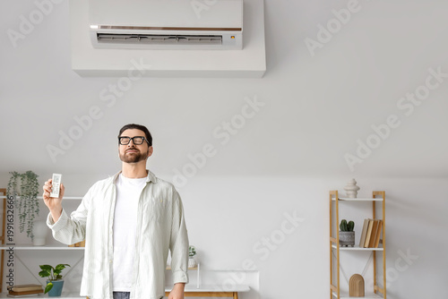 Young man with remote contr...