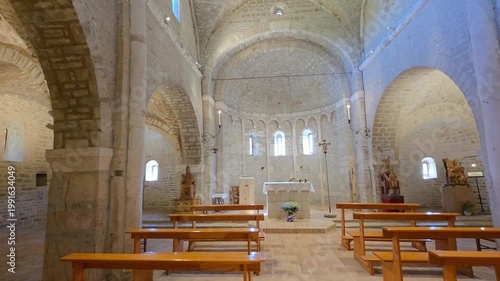 Interior of Sant'Urbano Abbey in Apiro, Italy: Medieval Romanesque Architecture with Stone Stairs, Vaults and 14th Century Fresco
