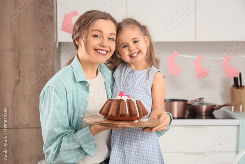 Happy mother and her cute d...