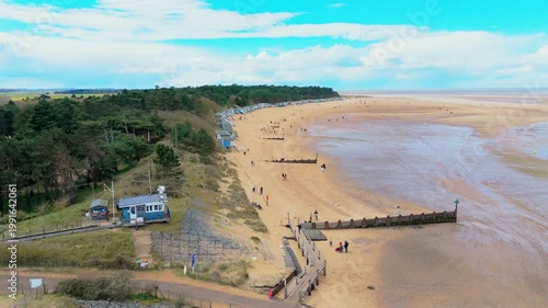 Wells Next to the Sea Beach. Sand dunes where Norfolk Coast path with beach huts and tourist beaches. Beach huts on the promenade at Gorleston-on-sea in Norfolk, UK