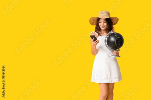 Young Asian woman with glob...