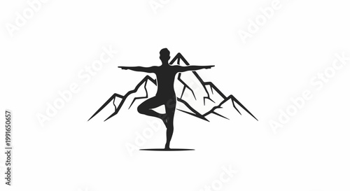 Silhouette of a person doing yoga pose in front of jagged mountains