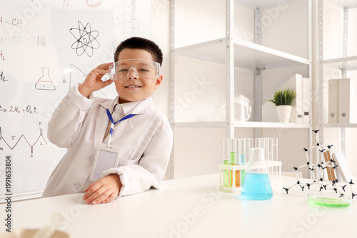 Cute little boy with scient...