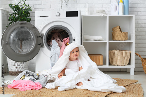 Cute toddler playing with c...