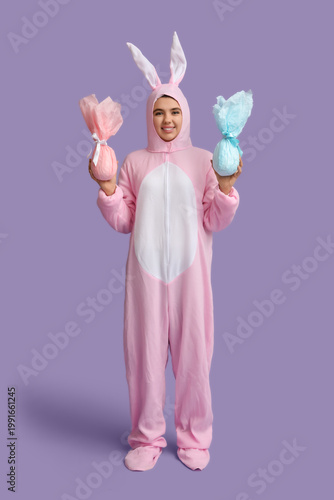 Happy young woman in bunny ...