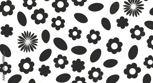 Playful seamless pattern with abstract black flowers and simple oval shapes scattered on an isolated white background.