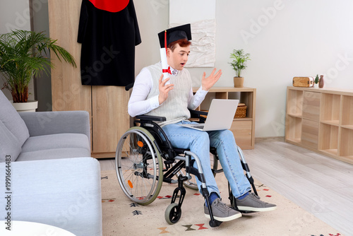 Male graduate in wheelchair...