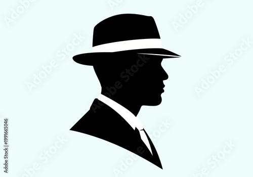 Silhouette of a man wearing a fedora hat