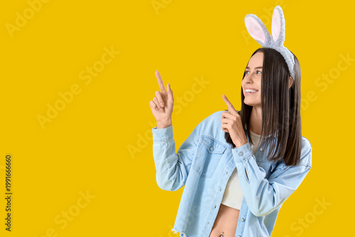 Young woman in bunny ears p...