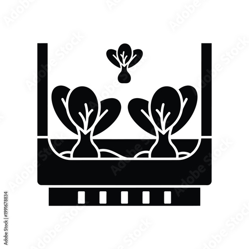 Solid black glyph icon of leafy vegetables growing in raised garden bed with irrigation pipes for agricultural and sustainable farming systems