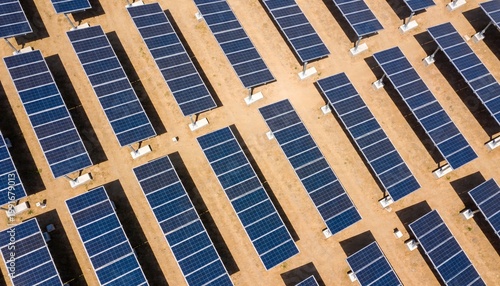 Aerial View of Solar Panels in a Desert Landscape During Daylight