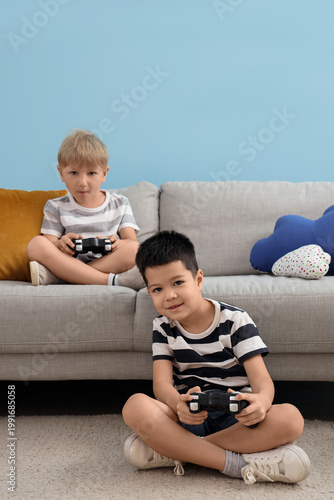 Cute little boys playing vi...