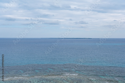 知念岬から眺める久高島と珊瑚礁広がる海岸