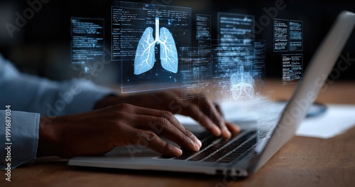 Hands typing on laptop with holographic medical data visualization of lungs