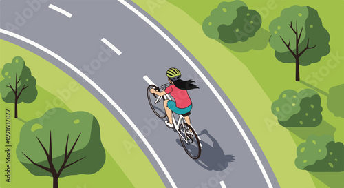 Woman cycling on a winding road surrounded by lush green trees and grass