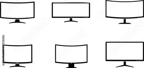 Various computer monitors with blank screens on white background