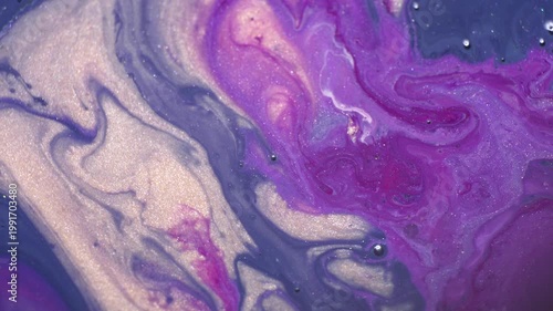 Macro video of flowing liquid acrylic paint in vibrant colors, creating dynamic abstract motion. Close-up footage of paint movement for cinematic backgrounds, digital design and creative projects